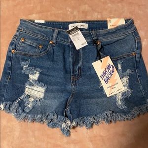 Ripped medium wash high waisted jean shorts